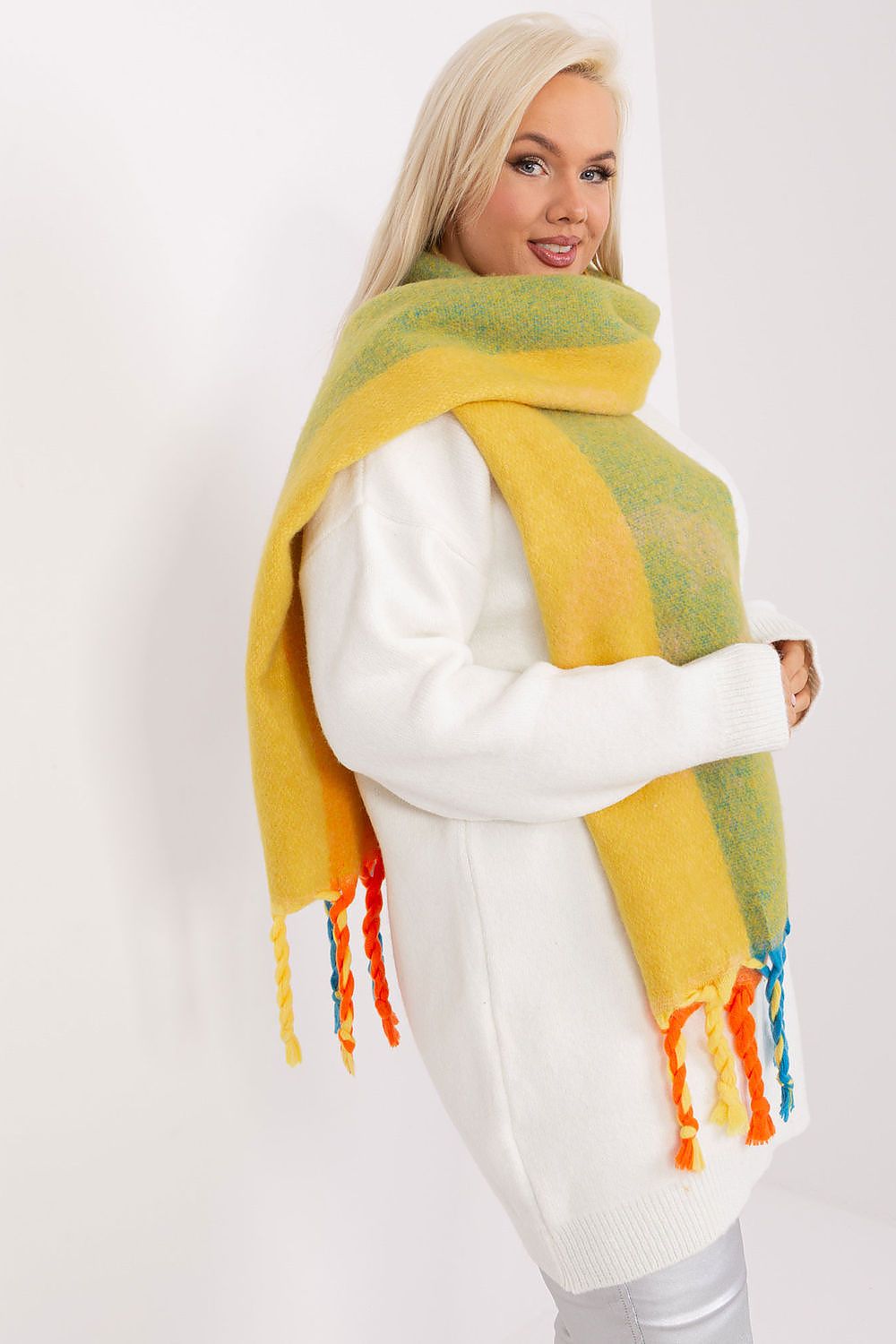 Trendy long scarf with intricate stripes, tassels, and made of 100% polyester by AT, essential accessory for colder days.