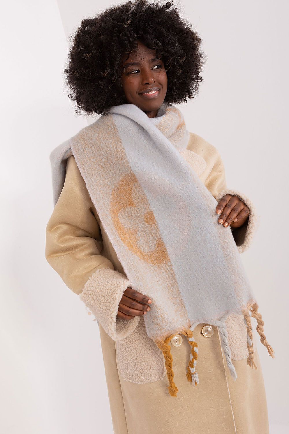 Stylish TA striped polyester shawl scarf with decorative tassels, ideal for versatile wear during the autumn and winter months.