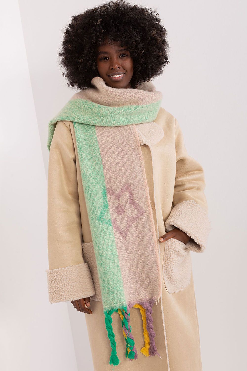 Luxurious striped polyester shawl by AT, elegantly designed for autumn-winter wear with sophisticated tassel details.