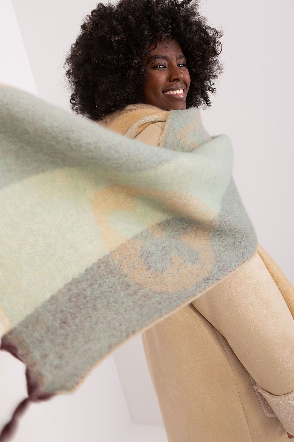 Elegant long striped polyester shawl scarf with tassels by AT, perfect for autumn-winter fashion, showcasing style and warmth.