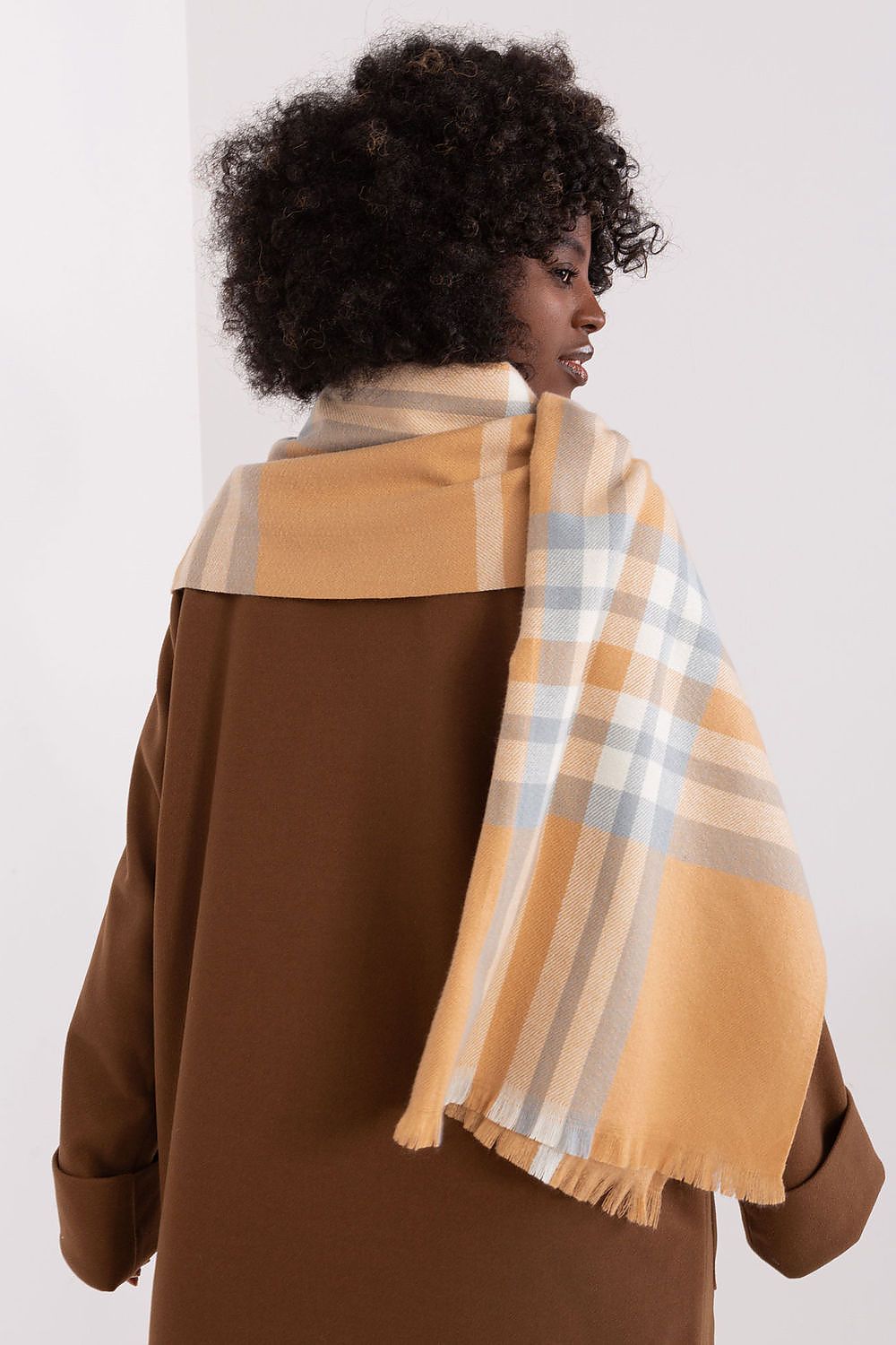 Chic long plaid scarf from AT, crafted with 100% polyester, perfect for layering in winter fashion.