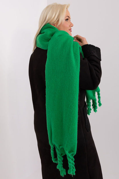 Sophisticated long polyester scarf by AT, showcasing a fashionable tassel detail, perfect for enhancing cold-weather attire.