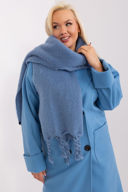 Versatile warm shawl by AT, showcasing a smooth texture and graceful tassels, ideal for a chic autumn look.
