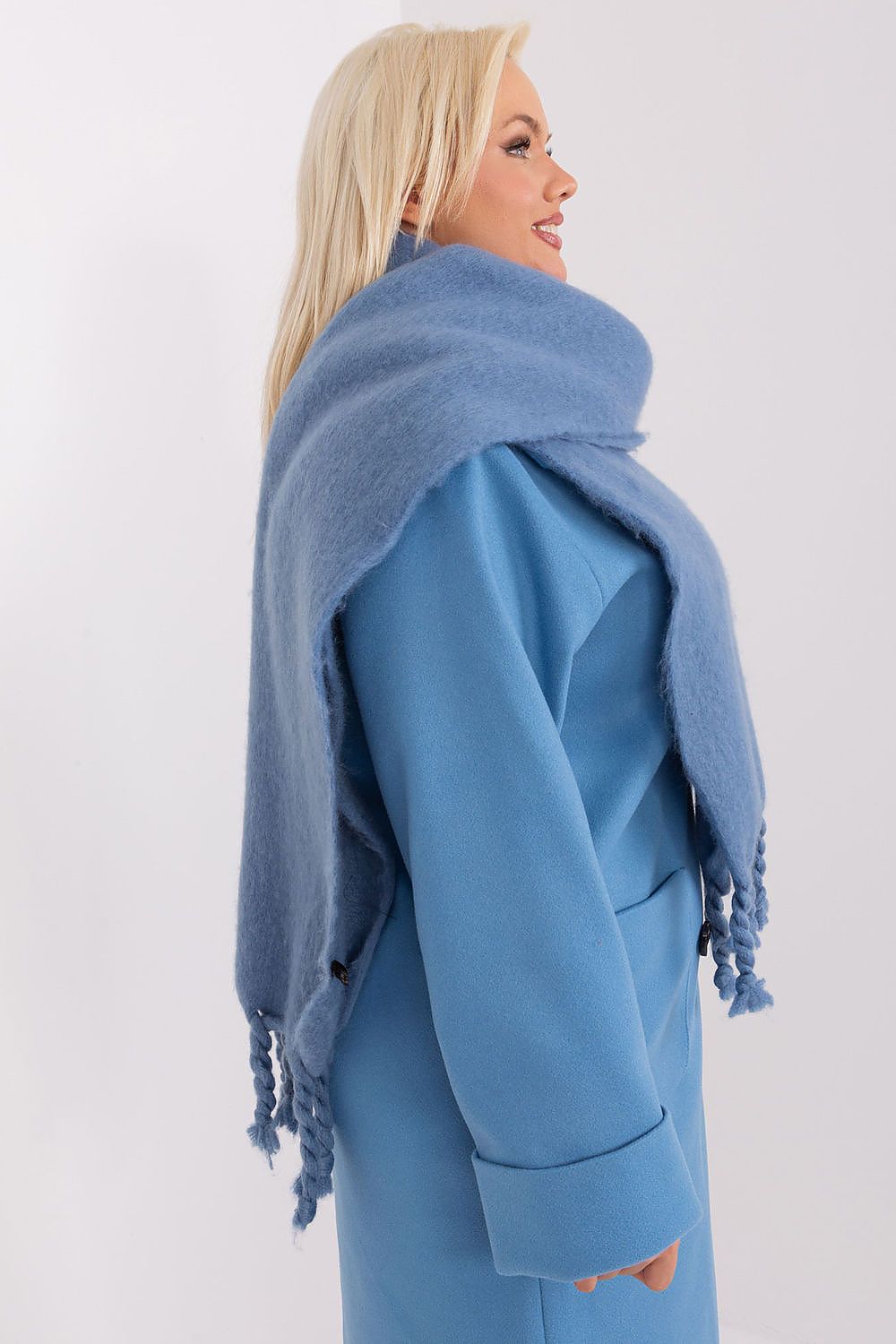 AT's luxury polyester scarf with tassels, adding warmth and character to your winter wardrobe.