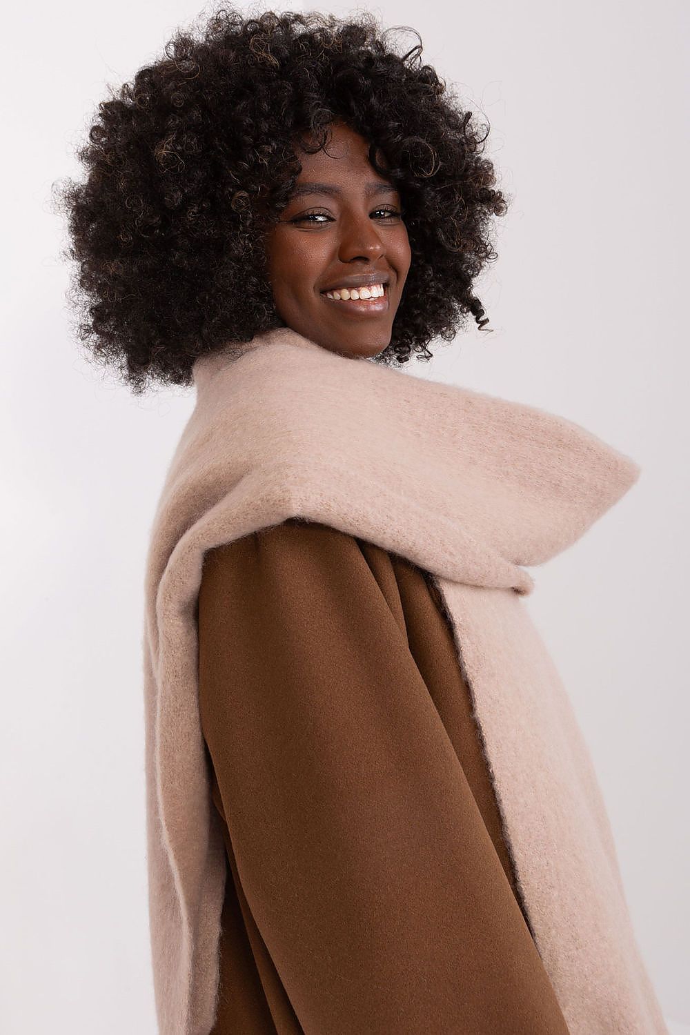 Versatile polyester shawl by AT, showcased draped elegantly, ideal for versatile styling options in colder seasons.