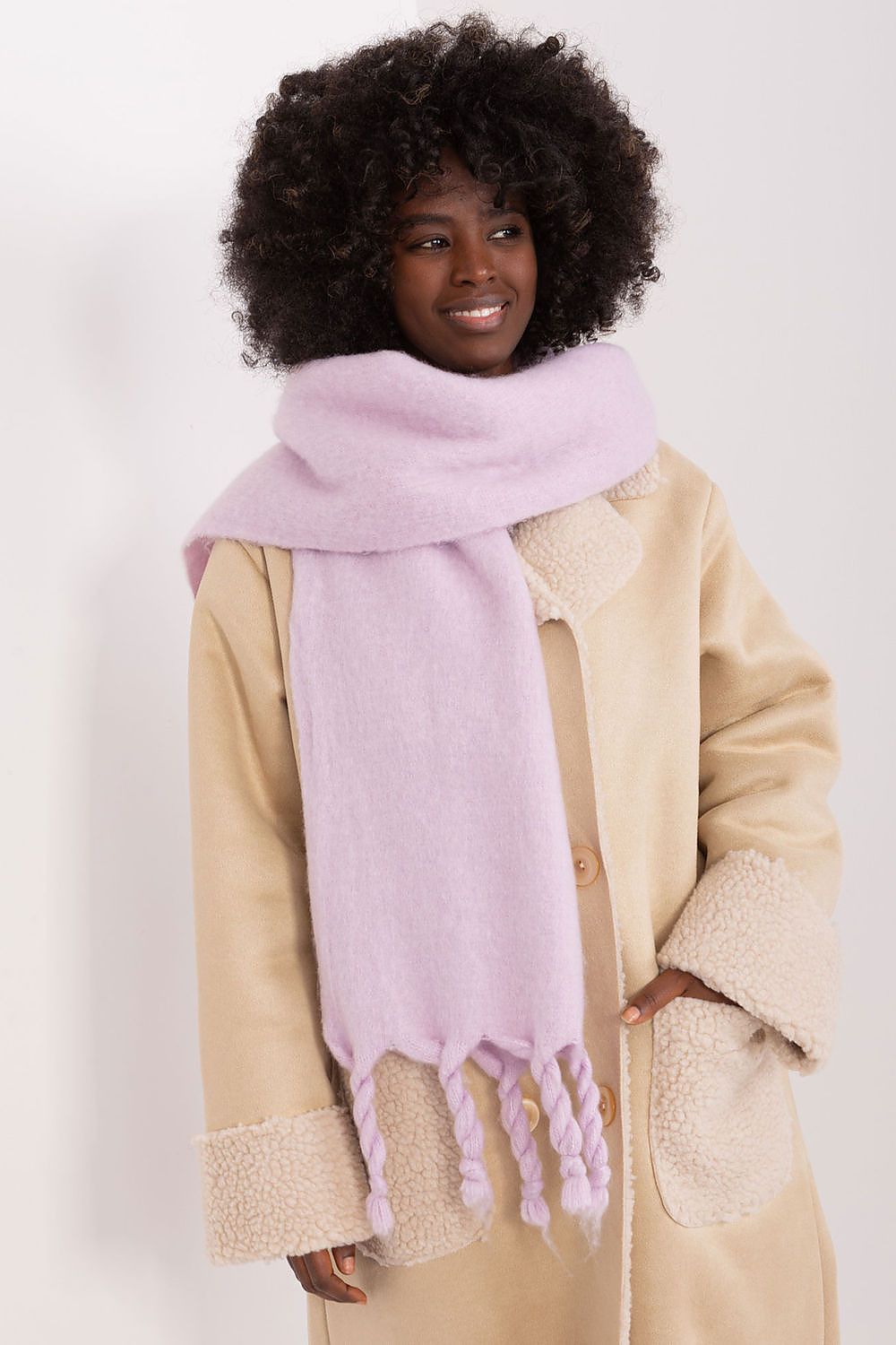 Close-up of AT luxury long scarf, highlighting the soft texture and stylish tassels, perfect for cosy fall and winter outings.