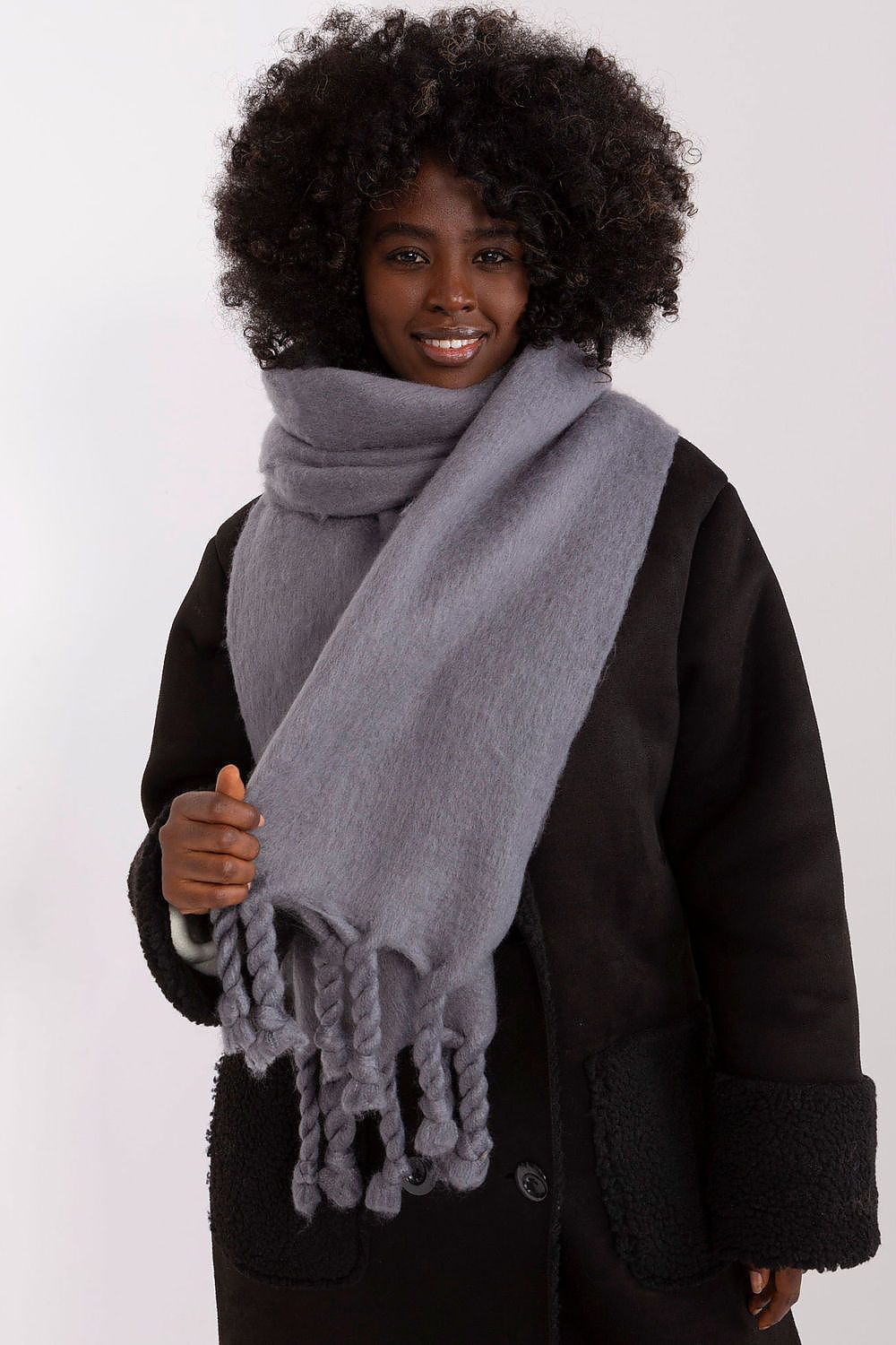 Luxurious 100% polyester long scarf with tassels by AT, perfect for fall and winter styling.