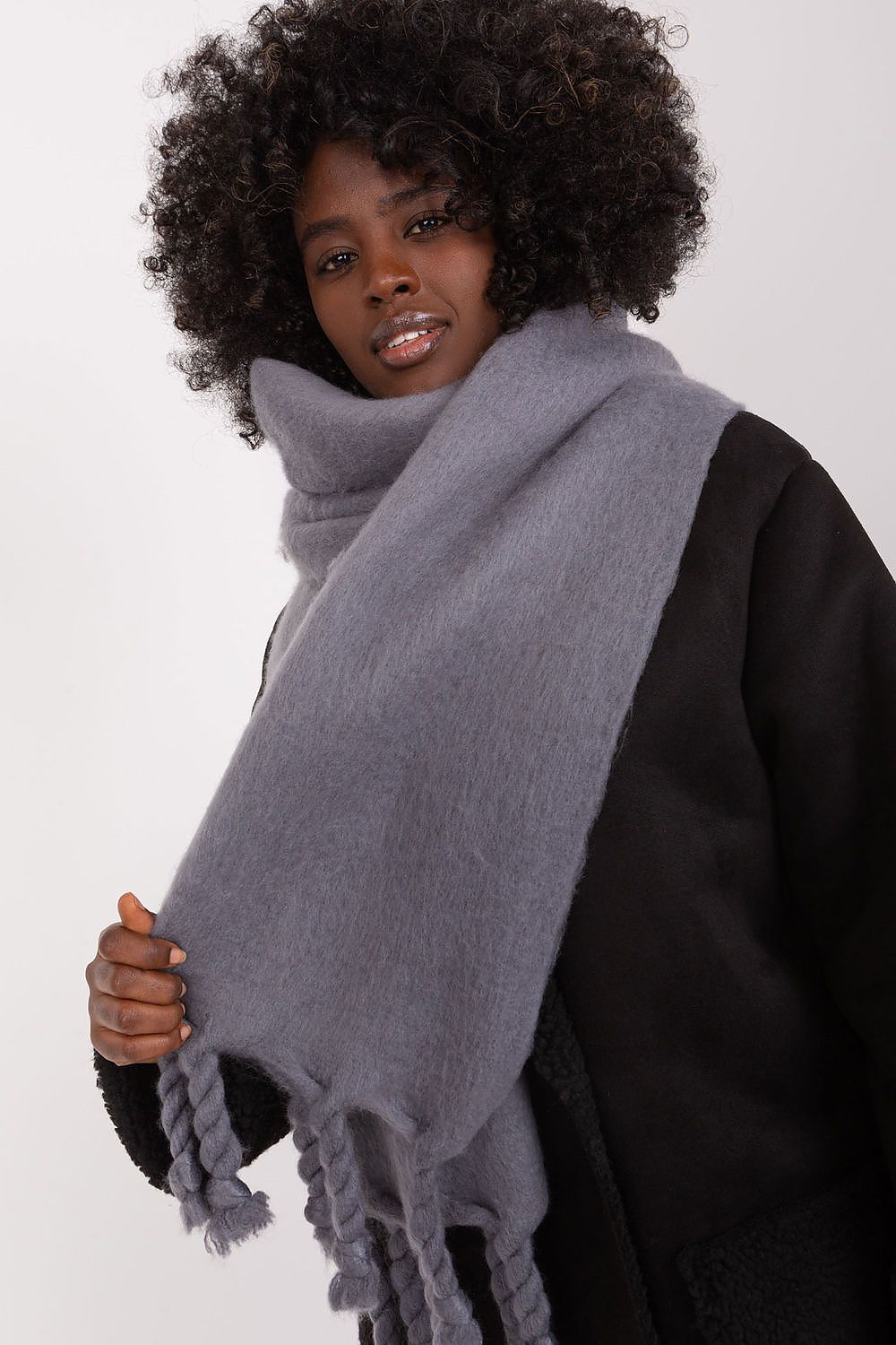 AT's luxury long scarf made of durable polyester, featuring fashionable tassels, perfect for layering in chilly weather.