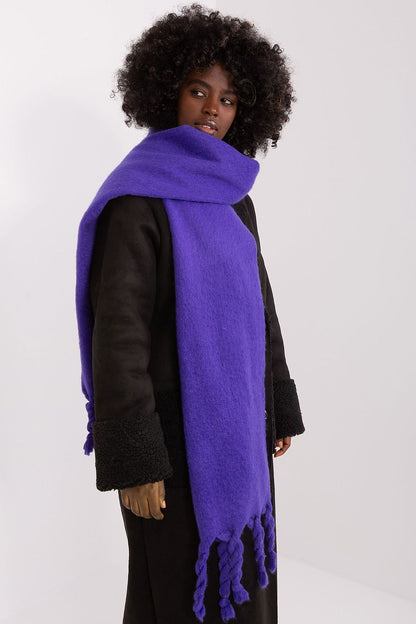 Versatile shawl by AT made from 100% polyester, featuring stylish tassels for a luxurious touch in any outfit.