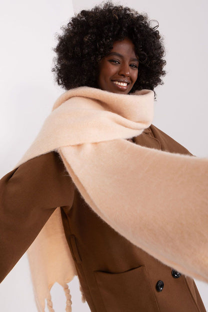 Stylish tasselled long scarf in smooth polyester by AT, ideal for adding elegance to your autumn and winter outfits.