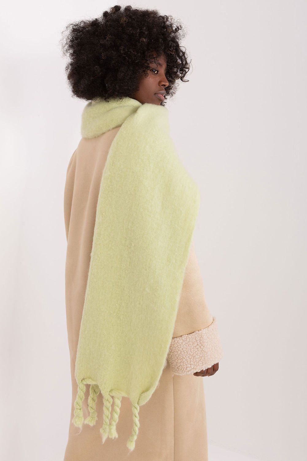 Luxurious 100% polyester long scarf by AT, featuring delicate tassels for a sophisticated touch in fall and winter wear.