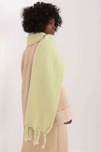 Luxurious 100% polyester long scarf by AT, featuring delicate tassels for a sophisticated touch in fall and winter wear.