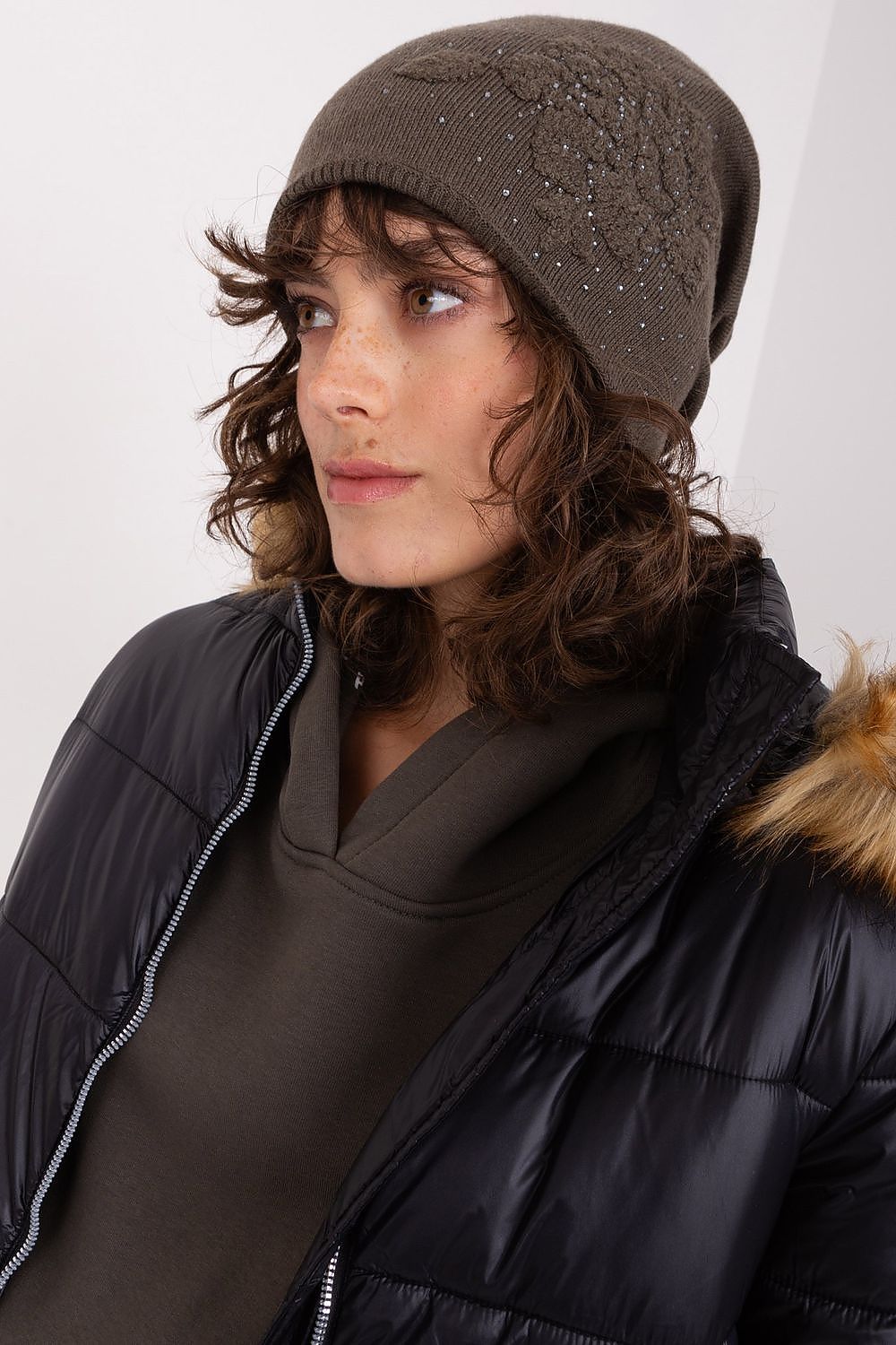 Luxury women's beanie hat by AT made from a cashmere blend, featuring decorative rhinestones for a chic winter look.