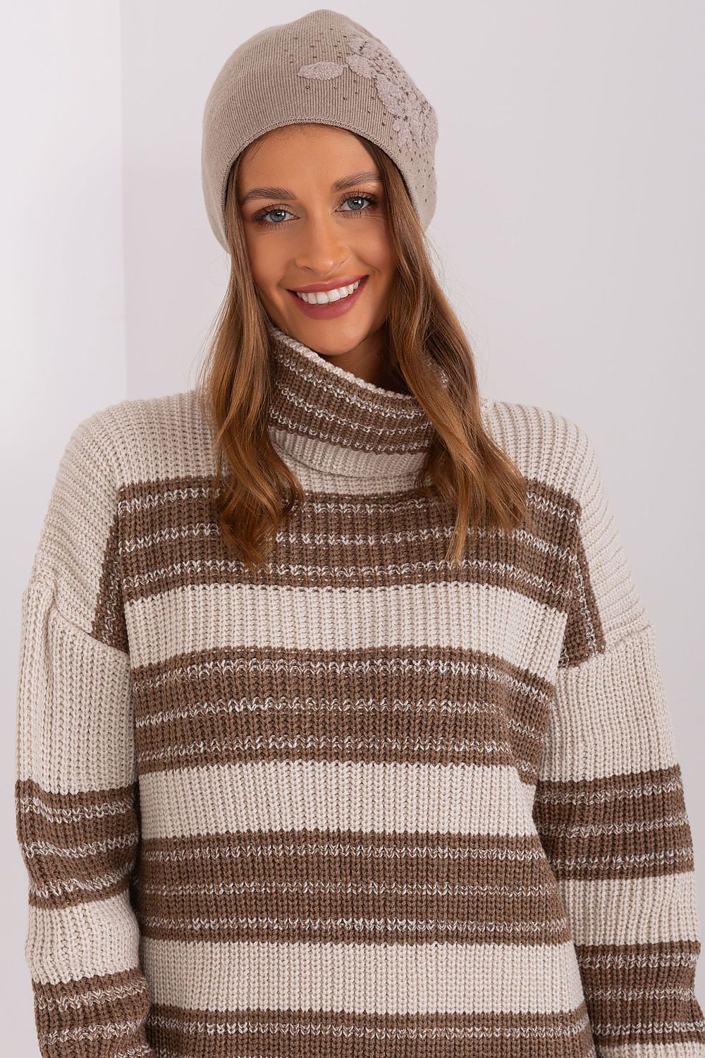 AT's high-quality women's cashmere blend beanie hat adorned with rhinestones, an essential accessory for stylish winter attire.