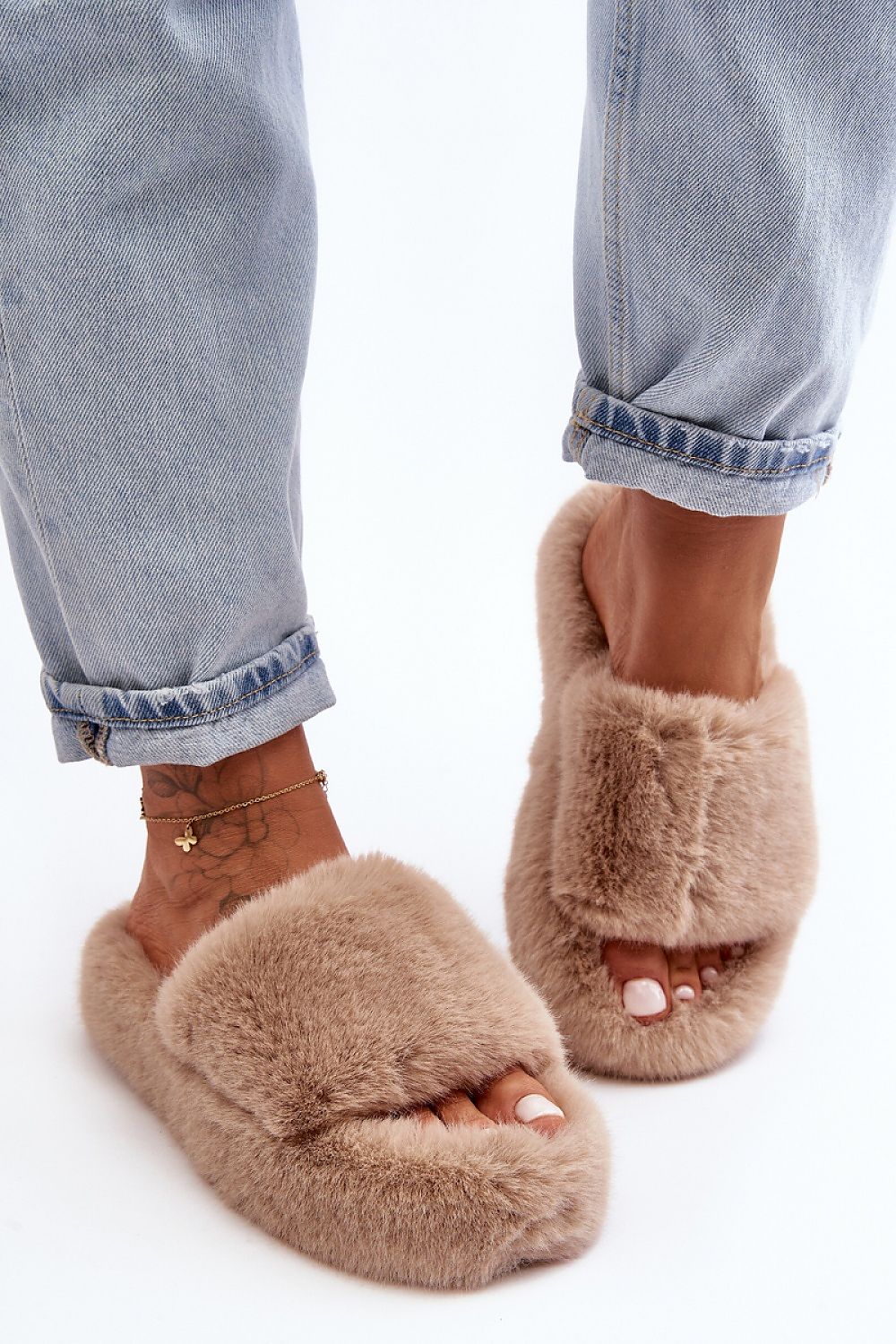 Step in Style eco-friendly fur slippers for women, featuring a comfortable rubber sole and elegant open toe, perfect for luxury relaxation.