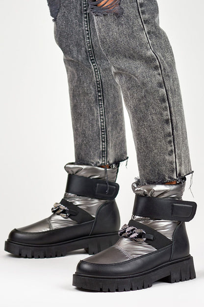 Close-up of Primo Snow Boots with soft eco fur lining and sleek design, perfect for winter fashion.