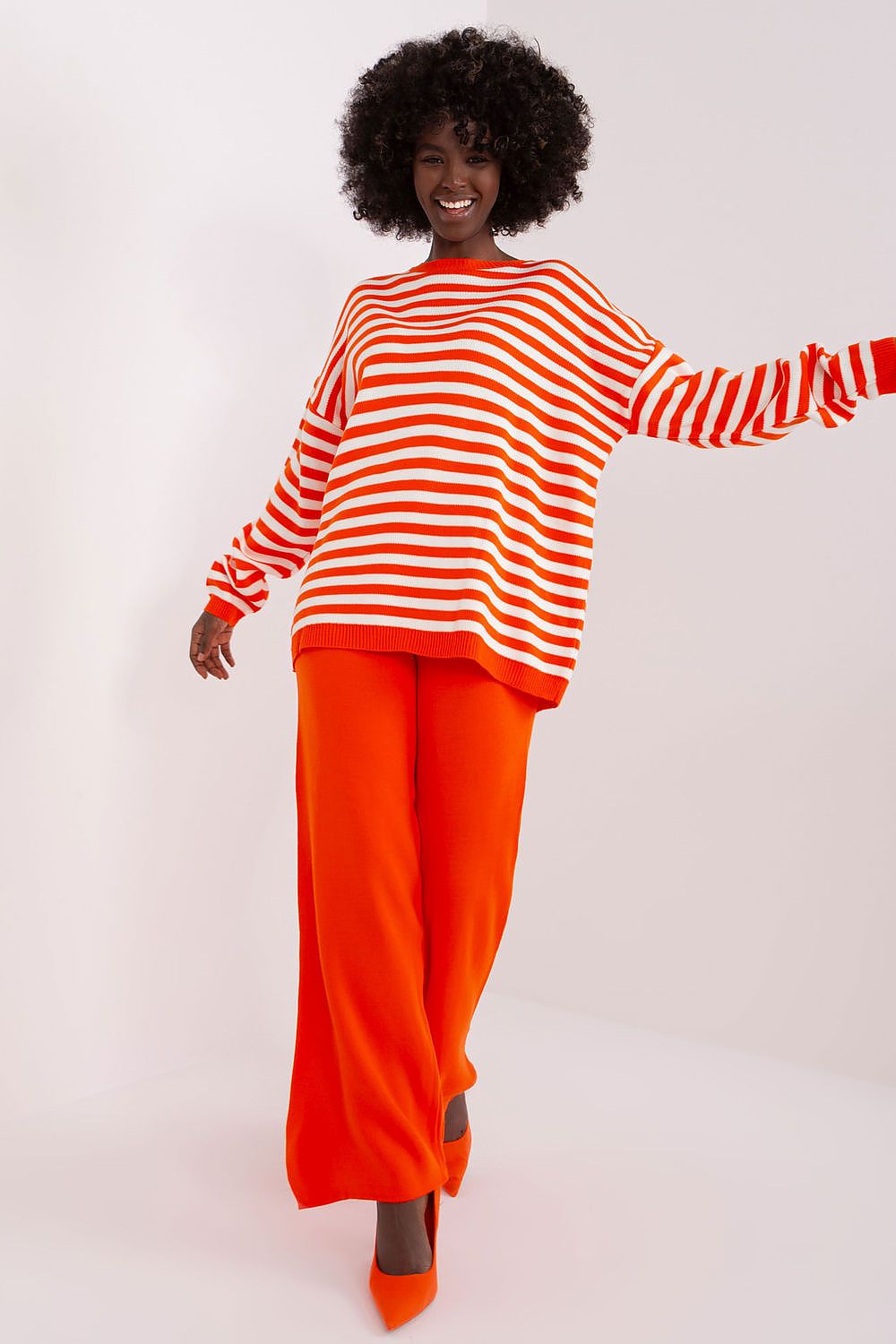 Badu Striped Sweater and Wide-Leg Trousers Set showcasing luxurious acrylic texture in a stylish casual ensemble.