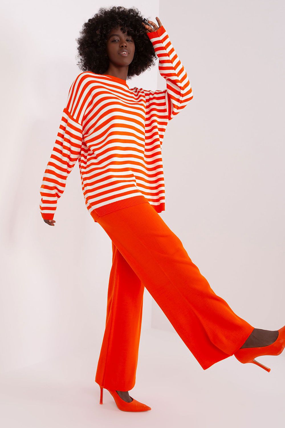 Wide-leg trousers of Badu's Striped Sweater set displaying contemporary design and comfort, ideal for versatile styling.