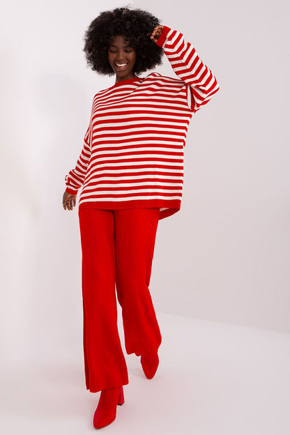 Chic detail of Badu's acrylic striped casual wear, highlighting the playful stripes and luxurious fabric.