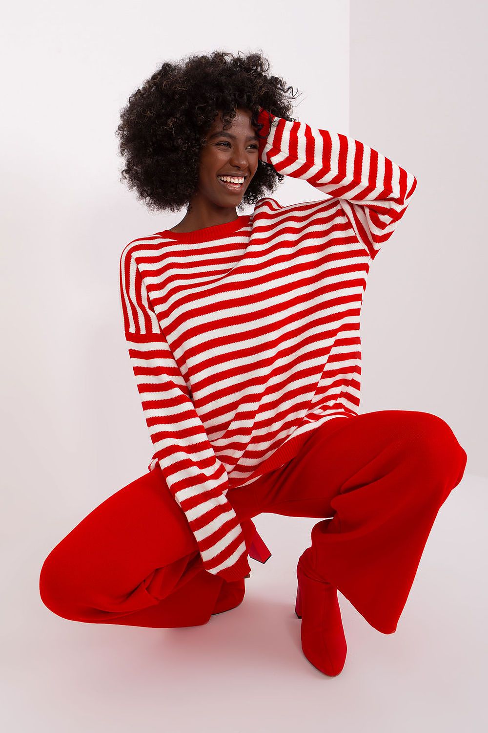 Luxurious Badu striped sweater set, featuring a chic round neckline and long sleeves, depicted in high-quality acrylic for ultimate comfort and style.