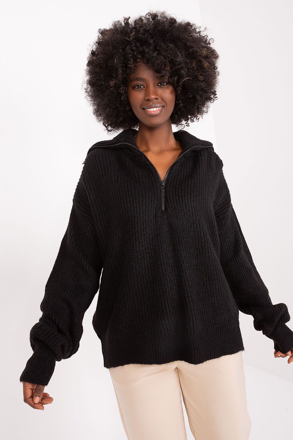 Chic Badu turtleneck sweater draped on model, embodying comfort and sophistication for casual outings.