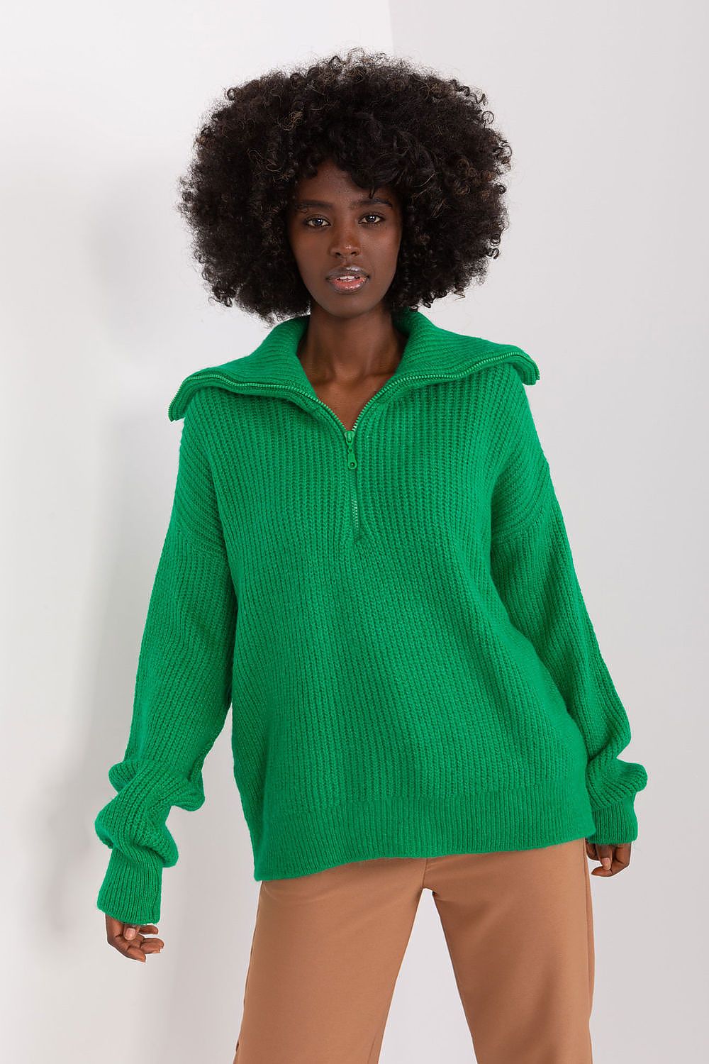 Model wearing Badu's luxury turtleneck sweater, styled with elegant accessories for a sophisticated everyday look.