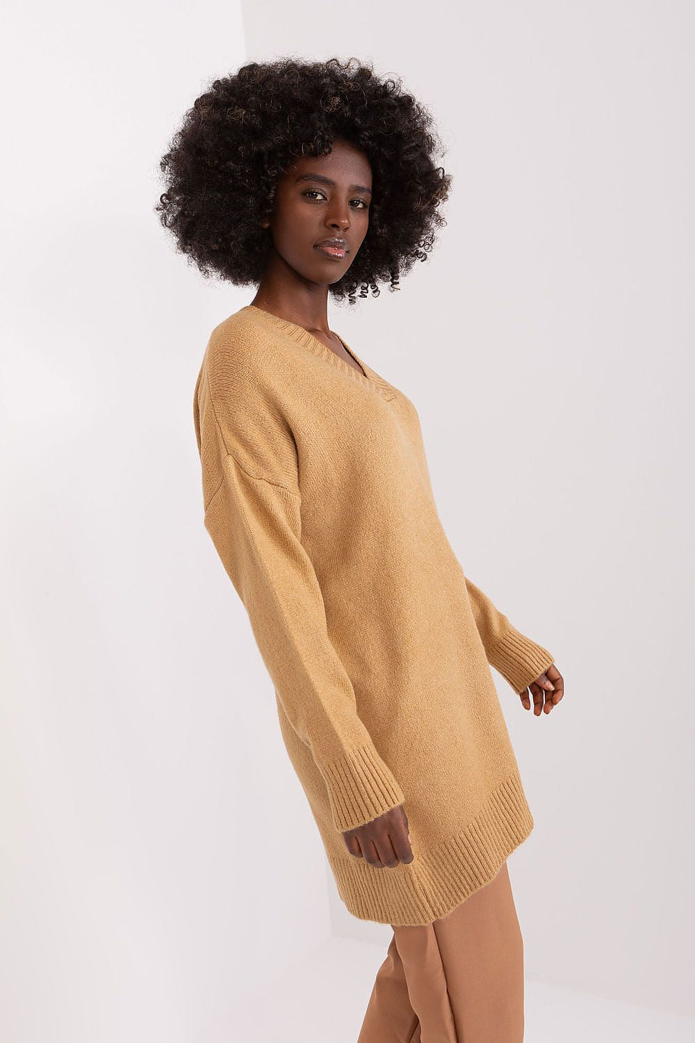 Stylish long sleeve sweater by Badu, perfect for both casual and formal occasions, with a sophisticated heart neckline.