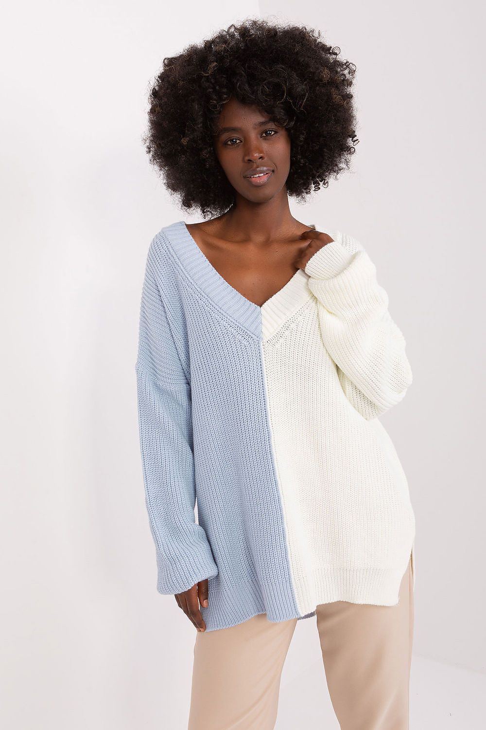 Elegant two-tone women's acrylic wool long sleeve sweater by Badu featuring a stylish heart neckline and subtle side slits, perfect for a fashionable and refined casual look.