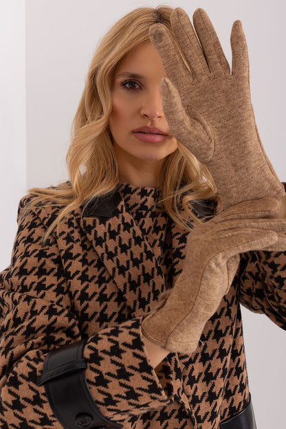 Designer insulated gloves for women by AT, featuring a unique geometric pattern and stylish wrist pompoms.