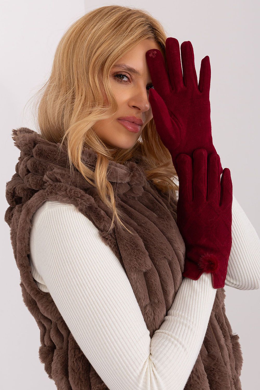 Elegant women's insulated gloves by AT featuring a decorative geometric pattern and stylish pompoms at the wrists.