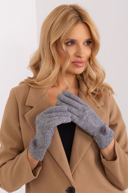 Chic Women's Knitted Gloves with elegant designs and pompoms by AT, perfect for stylish winter wear.