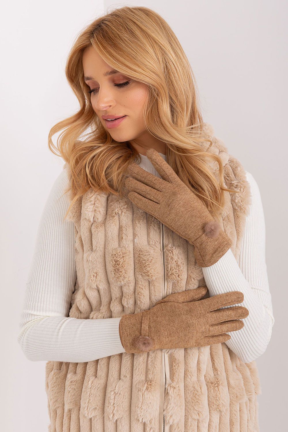 Luxury knitted gloves for women by AT, crafted with 60% cotton and adorned with charming pompoms at the wrist.