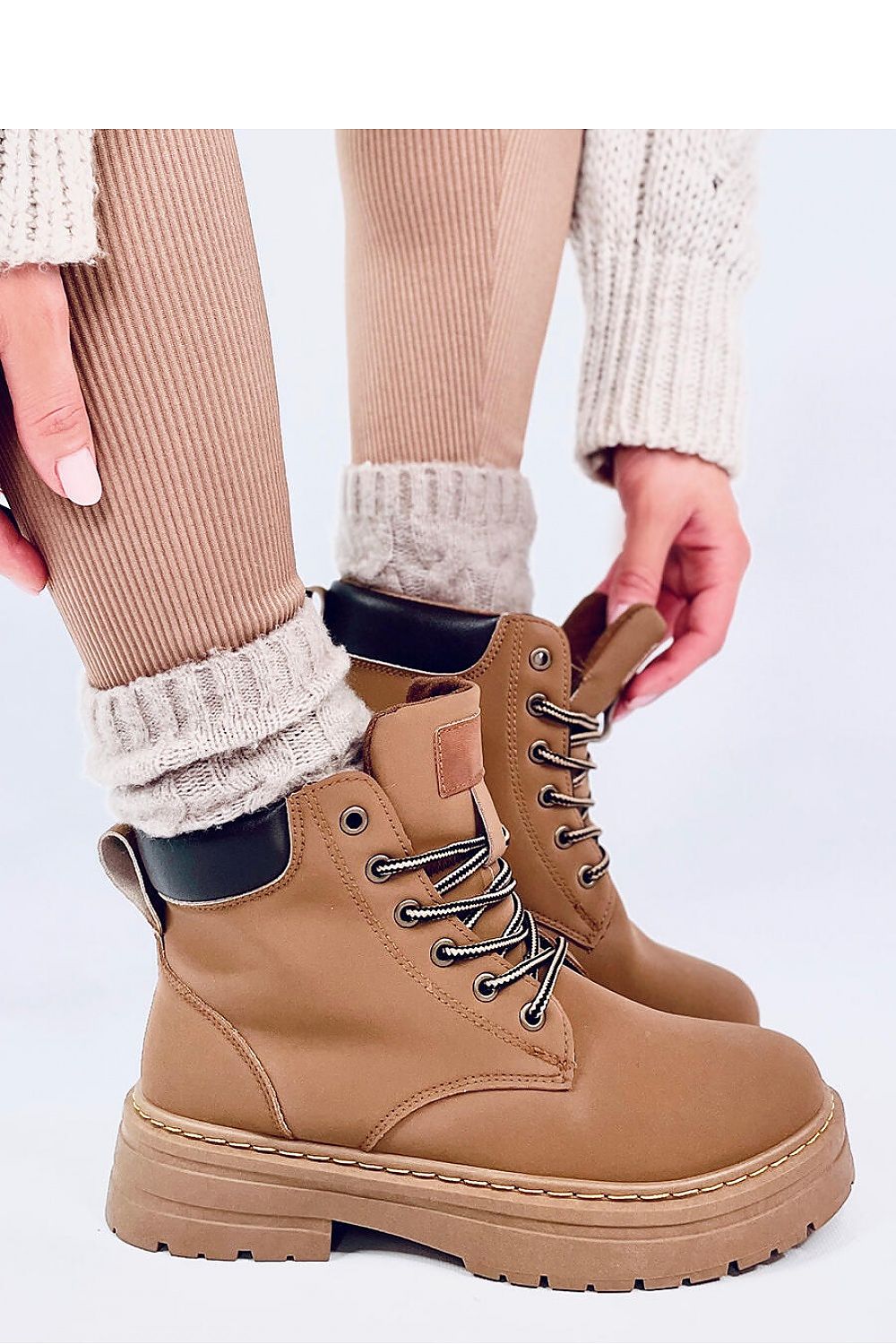 Elegant Inello women's trapper boots with traditional lacing design, showcasing a fashionable cut and durable sole for perfect fit and comfort.