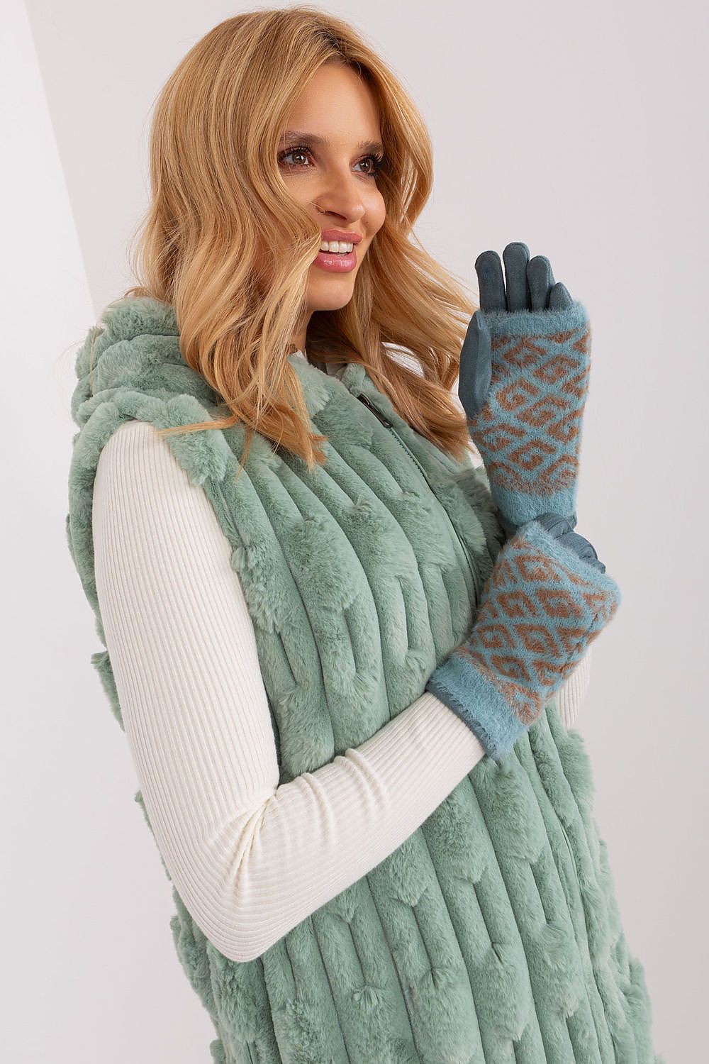 Stylish and functional women's gloves by AT, perfect for cold weather with phone-compatible touchscreen fingertips.