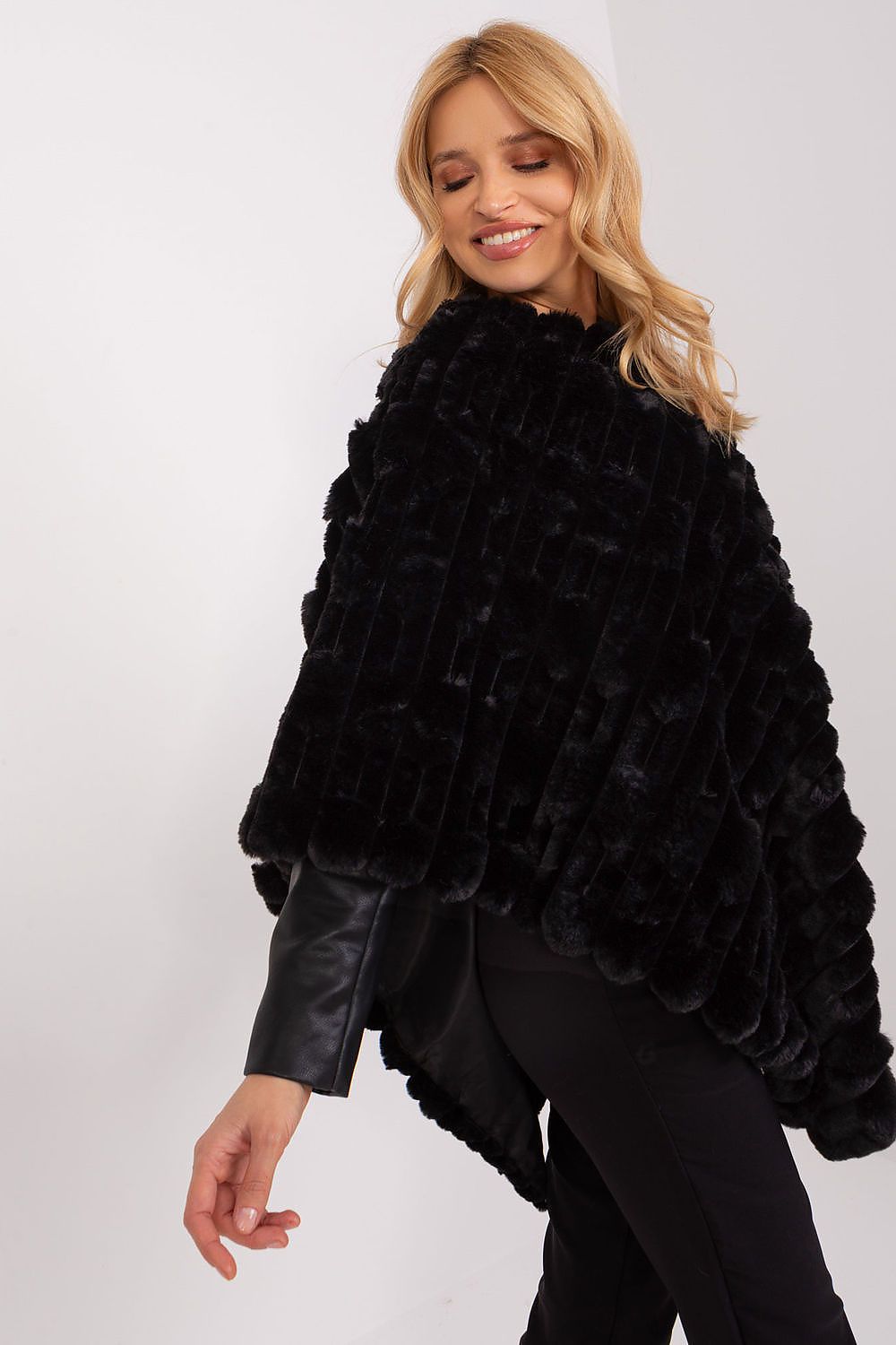 High-quality poncho by AT featuring a relaxed fit and round neckline for ultimate comfort and style.