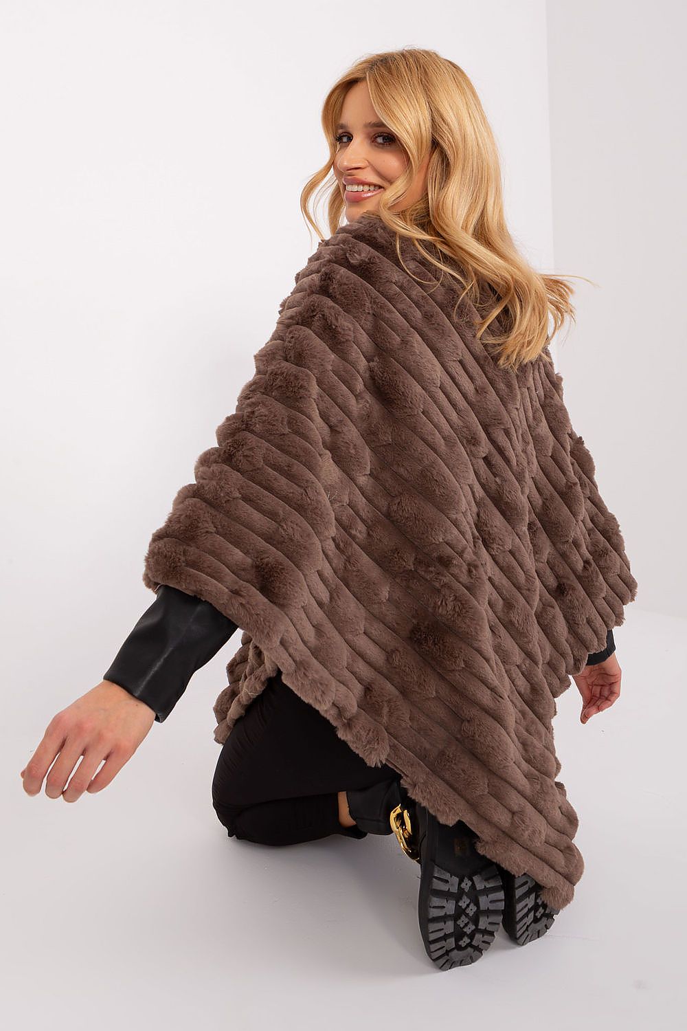 Sophisticated Casual Poncho by AT, perfect for dressing up or down, made from durable and lightweight fabric.