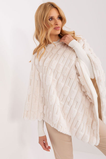 Stylish display of the luxurious poncho by AT, featuring a round neckline and comfortable fit, ideal for expressing individuality in fashion.