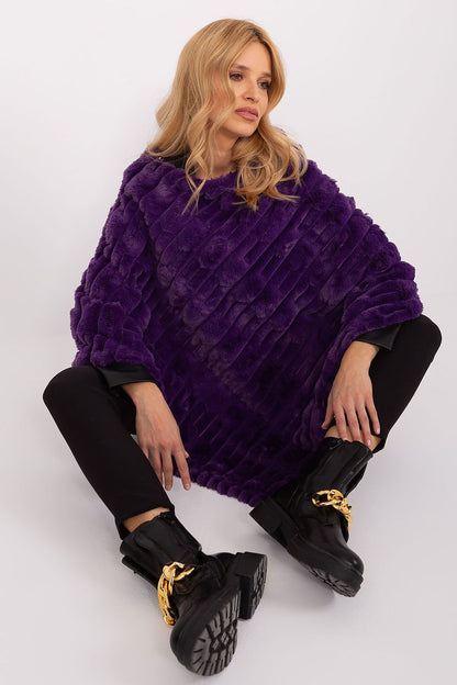 Elegant casual poncho by AT, designed with a sophisticated varied texture and a flattering round neckline, ideal for effortless street style.