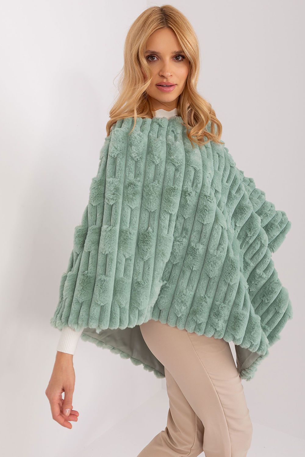 Elegant poncho design by AT showcasing soft round neckline and lightweight 100% polyester fabric, ideal for casual outings.