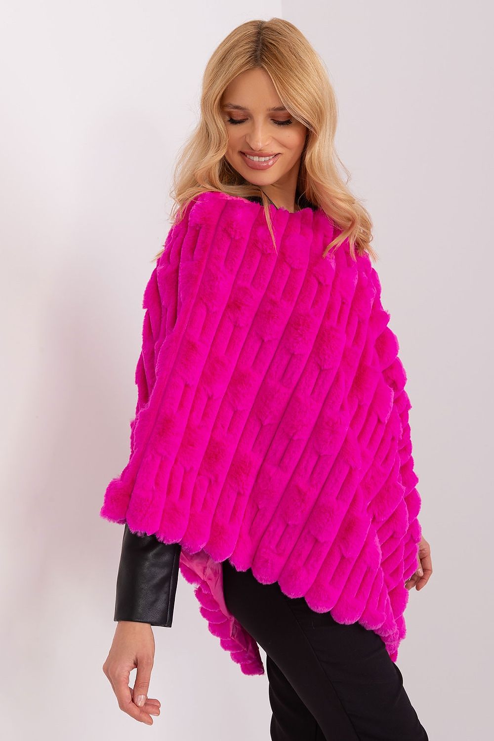 Elegant poncho by AT, showcasing a relaxed fit with a round neckline, ideal for everyday chic outfits and comfort.