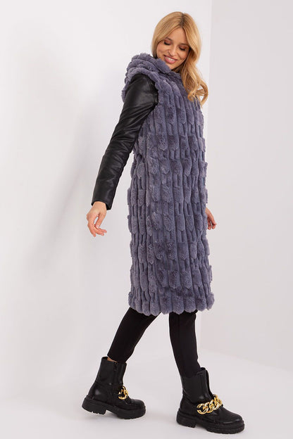 AT's exquisite fur vest with zipper closure and insulation, showcasing style and functionality for cold winter days.