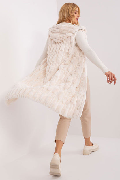 Stylish women's fur vest with hood by AT, designed for winter elegance and comfort, displaying its luxurious appearance.