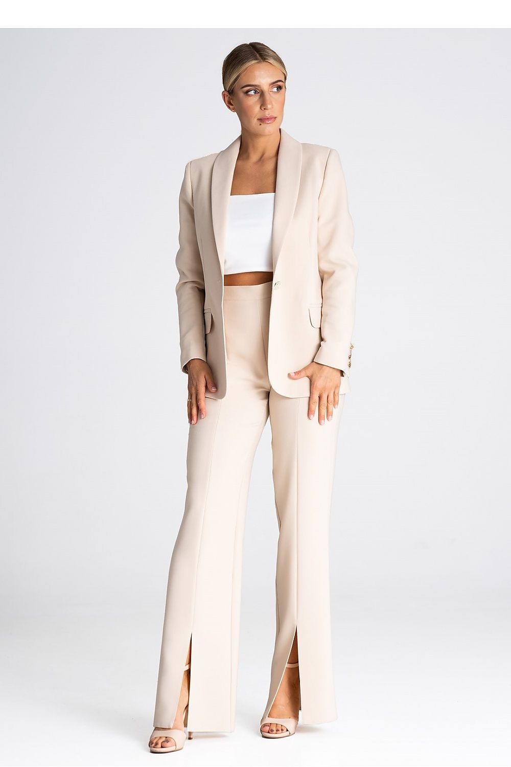 Luxurious Figl long pants with a striking front slit, combining comfort and sophistication.