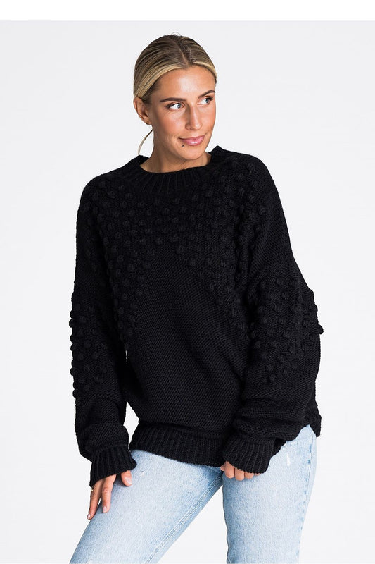 Elegant Figl long sleeve sweater featuring decorative pom-poms and ribbed detailing, crafted from a soft acrylic blend, perfect for luxurious winter styling.