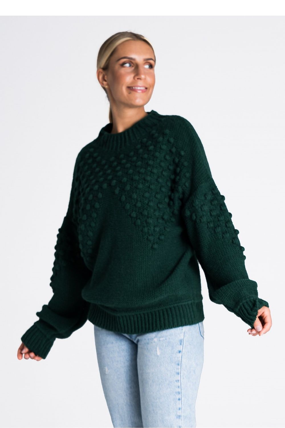 Stylish Figl long sleeve sweater showcasing ribbed cuffs and hem, adorned with pom-poms for a touch of sophistication.
