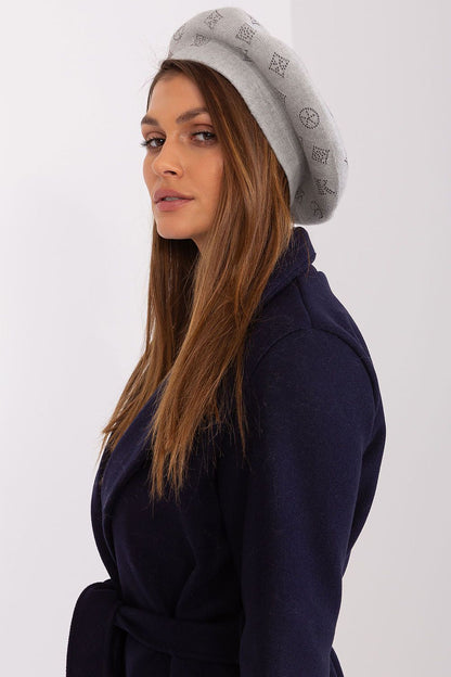 Chic beret with captivating rhinestone embellishments by AT, expertly knitted from a soft mix of acrylic, cotton, and cashmere.