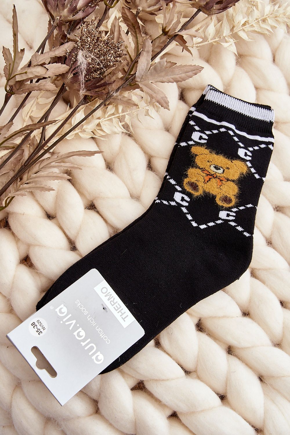 Luxurious women's cotton socks from Step in Style, featuring a charming teddy bear patch, perfect for adding comfort to your winter wardrobe.