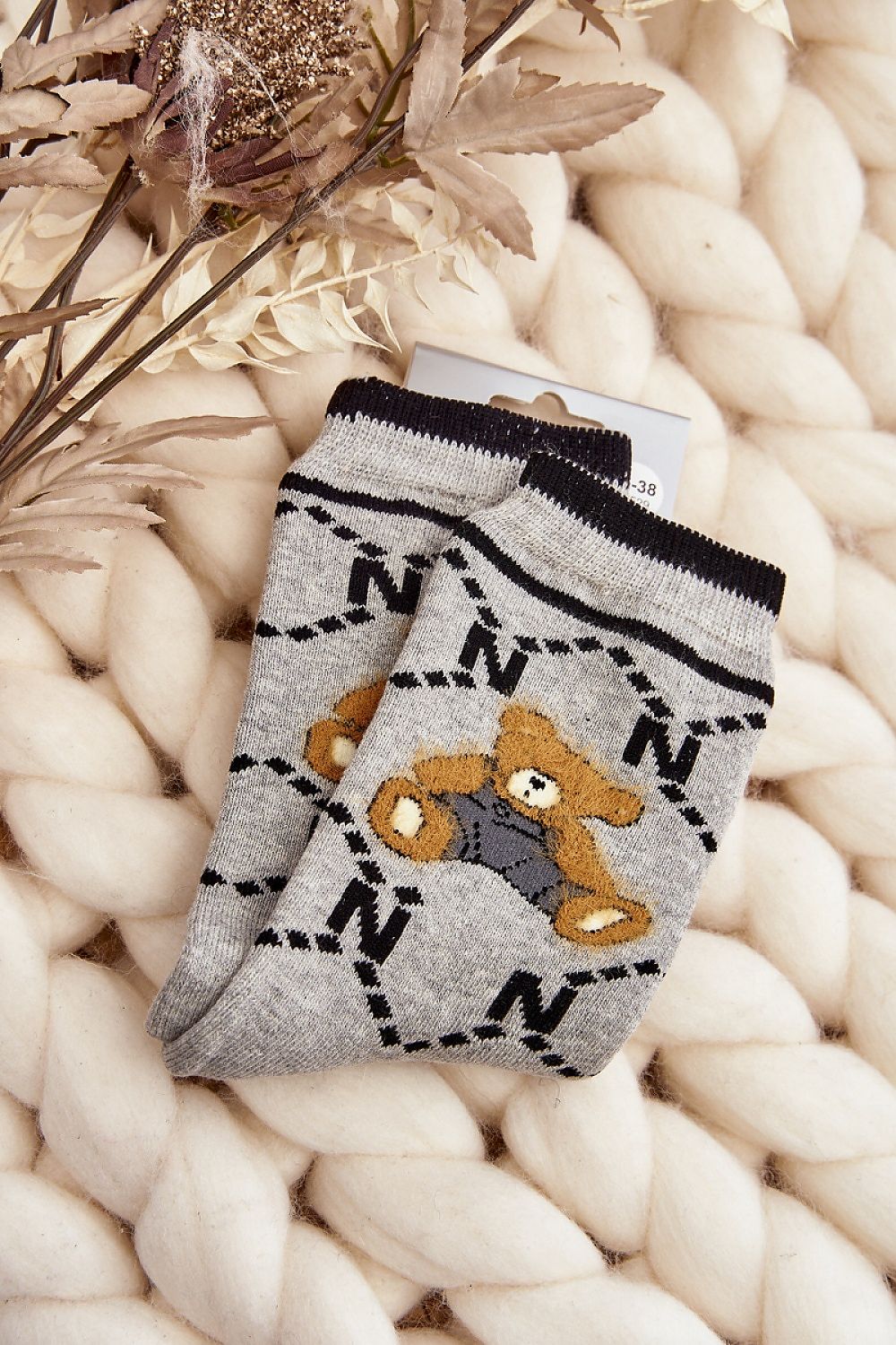 Luxurious women's cotton socks with teddy bear patch by Step in Style, perfect for keeping warm on cold days.