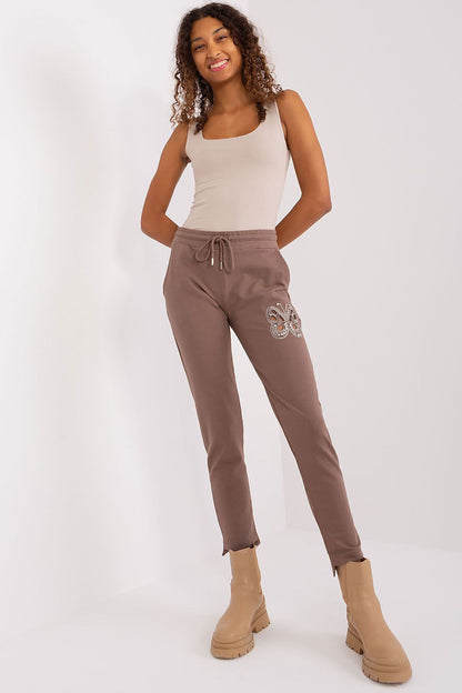 Sophisticated cotton blend sweatpants by Relevance, featuring a stylish high waist and unique rhinestone butterfly detailing, ideal for casual outings.