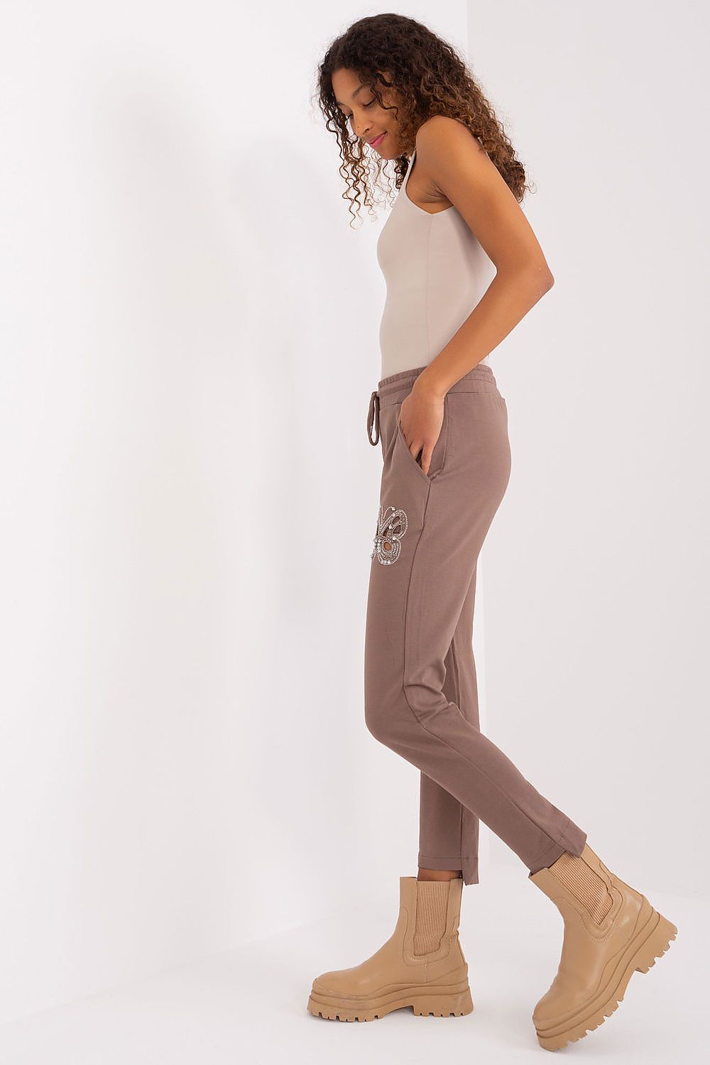 Sophisticated Relevance high waist sweatpants with rhinestone butterfly accents, perfect for stylish comfort in everyday wear.